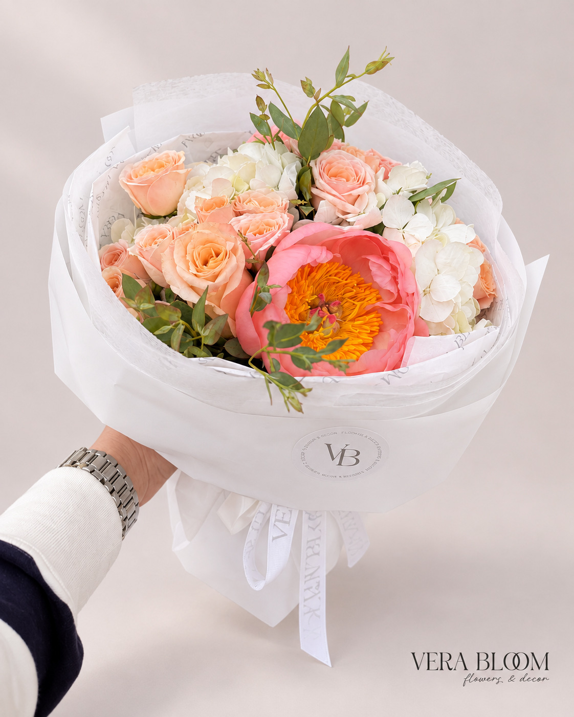 Coral Peony Garden Bouquet with a coral peony, peach roses and white flowers.